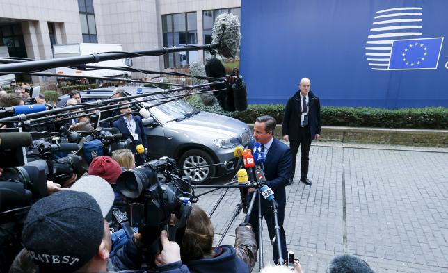 British Prime Minister David Cameron speaks to the media as he arrives at a European Union leaders summit addressing the talks about the so-called Brexit and the migrants crisis in Brussels