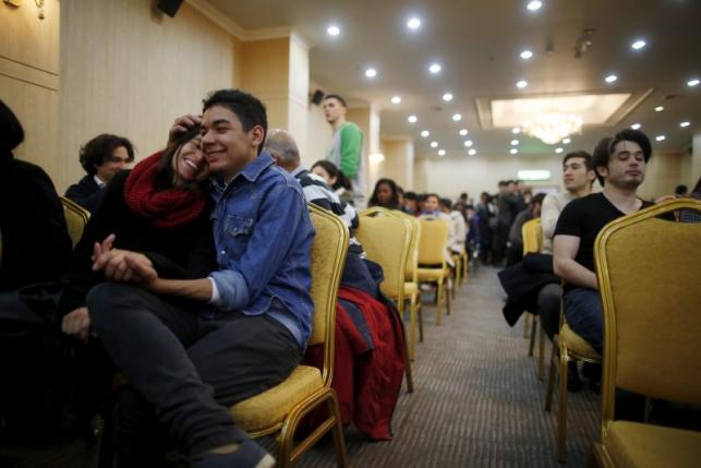 Nicolas Melgarejo and Judith Corales of Argentina share a moment during an orientation for upcoming mass wedding ceremony of the Unification Church at a resort in Yangpyeong