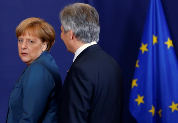 File photo of Germany's Chancellor Merkel and Austria's Chancellor Faymann