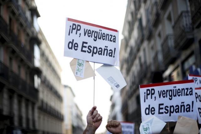 File photo of people protesting outside the People's Party (PP) headquarters in Madrid, Spain