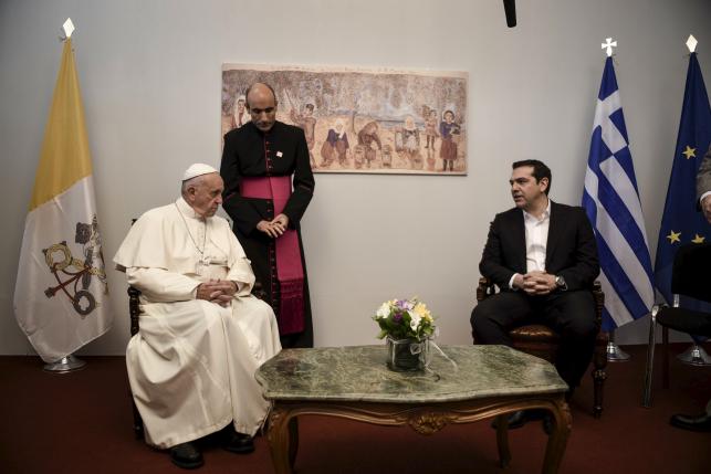 Handout photo of Pope Francis and Greek Prime Minister Alexis Tsipras meeting as Pope Francis visits the Greek Island of Lesbos aiming at supporting refugees and drawing attention to the front line of Europe's migration crisis in Lesbos