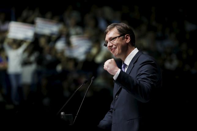 Serbian Prime Minister and leader of the Serbian Progressive Party (SNS) Vucic gestures during a rally ahead of Sunday's election, in Belgrade