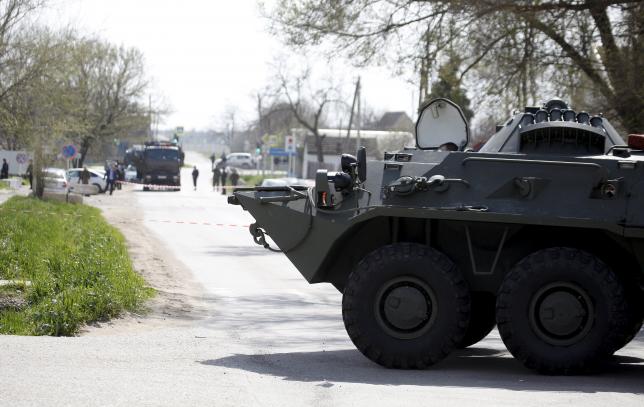 A vehicle of the Russian armed forces blocks the way in a settlement of the Novoselitsky district, where a local police station was recently attacked, in Stavropol region, southern Russia