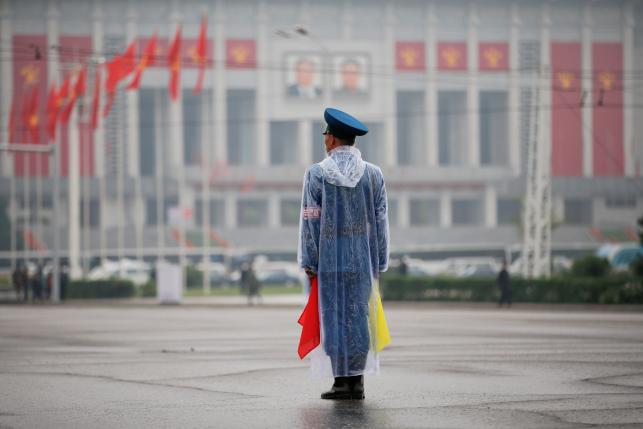 A policeman controls the traffic in front of April 25 House of Culture, the venue of Workers' Party of Korea (WPK) congress in Pyongyang, North Korea