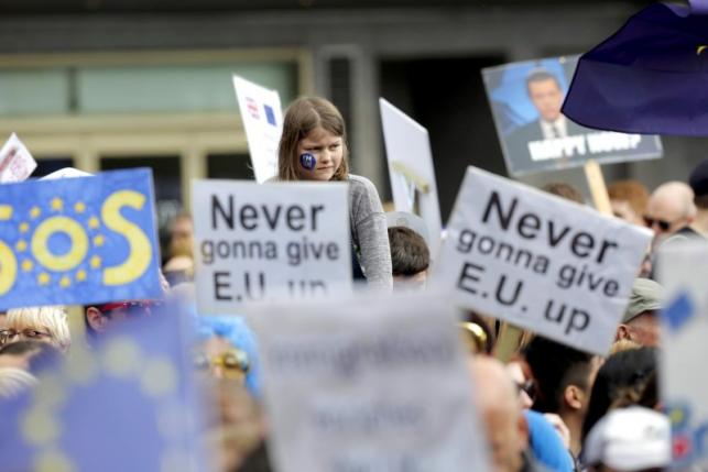Protestors wave banners during a demonstration against Britain's decision to leave the European Union, in central London
