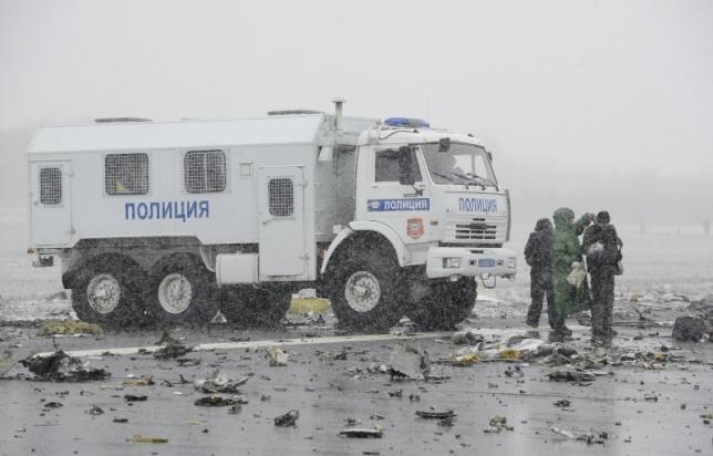 A police truck is seen at the crash site of Flight number FZ981, a Boeing 737-800 operated by Dubai-based budget carrier Flydubai, at the airport of Rostov-On-Don, Russia