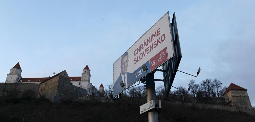 An election poster shows a candidate of Smer party and Slovakia's Prime Minister Fico in front of the Bratislava Castle in Bratislava