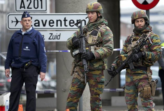 Belgian troops and police control a road leading to Zaventem airport following Tuesday's airport bombings in Brussels