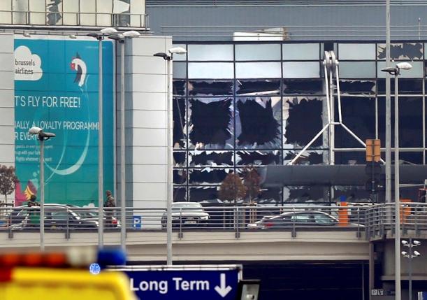 Broken windows seen at the scene of explosions at Zaventem airport near Brussels, Belgium