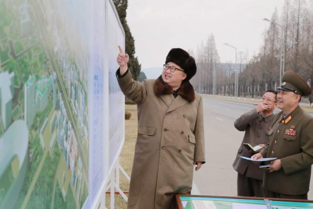 KCNA picture shows North Korean leader Kim Jong Un speaking at an event declaring the construction of Ryomyong Street