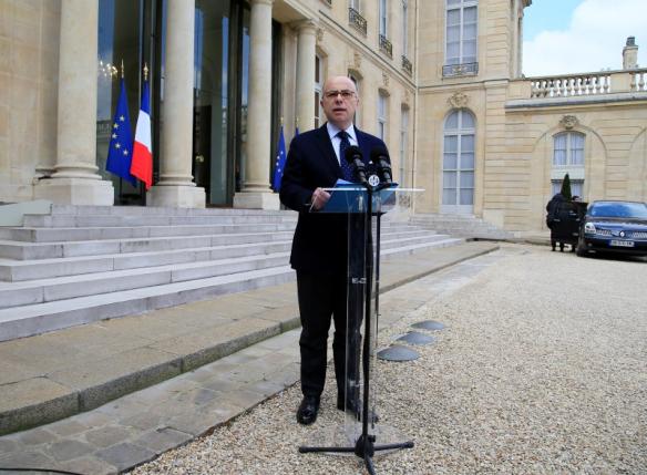 French Interior Minister Cazeneuve talks to journalists after a meeting about blasts in Brussels at the Elysee Palace in Paris
