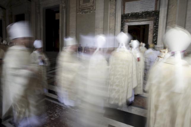 File photo of Cardinals walk in procession after Pope Francis opened the Holy Door to mark the opening of the Catholic Holy Year, or Jubilee, in St. Peter's Basilica, at the Vatican