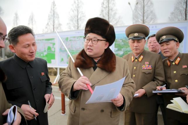 KCNA picture shows North Korean leader Kim Jong Un speaking at an event declaring the construction of Ryomyong Street