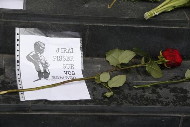 Flowers tributes are placed on steps of Belgian embassy in Berlin
