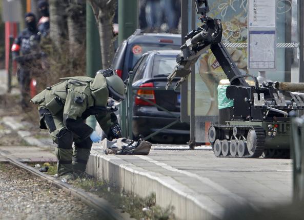Police use a robotic device as they take part in a search in the Brussels borough of Schaerbeek following Tuesday's bombings in Brussels.