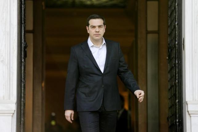 Greek PM Tsipras arrives to welcome European Council President Tusk at the Maximos Mansion in Athens