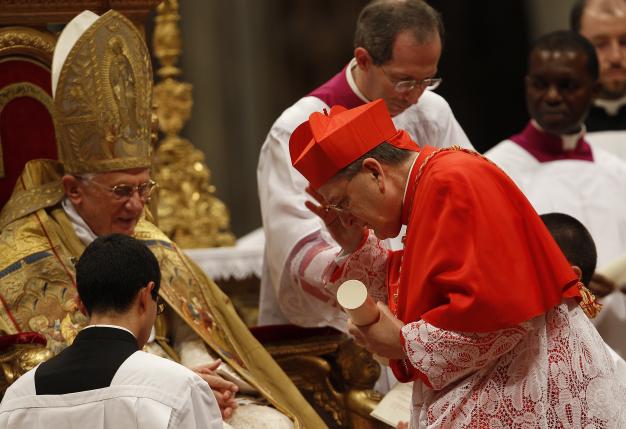 File photo of New cardinal Raymond Leo Burke of U.S. receiving the red biretta, a four-cornered red hat, from Pope Benedict XVI during the Consistory ceremony in Saint Peter's Basilica at the Vatican