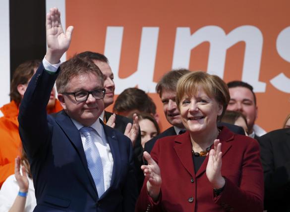 German Chancellor Merkel applauds CDU's Baden-Wuerttemberg top candidate Wolf after election campaign rally Haigerloch
