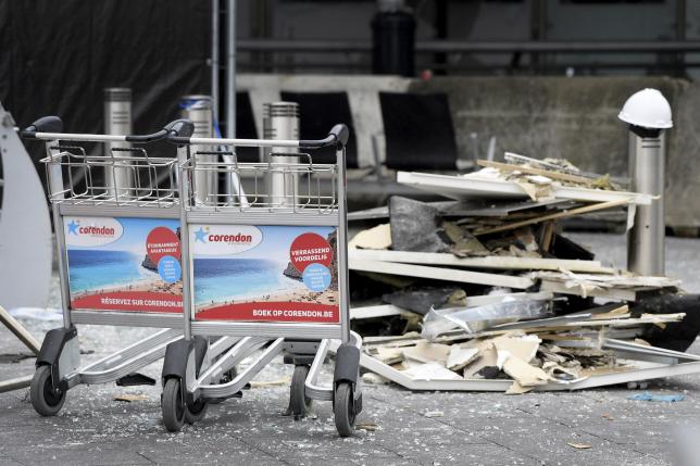 Wreckage are seen outside the terminal at Brussels International airport following bomb attacks in Brussels metro and Belgium's airport of Zaventem