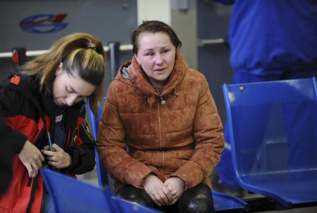 Relative of a victim of crashed Flydubai Boeing 737-800 reacts at airport of Rostov-On-Don