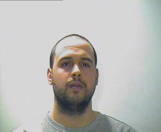 A man, whom Interpol said is named Khalid El Bakraoui, is seen in this undated photo, after he was suspected of involvement in the Brussels airport and metro attack.