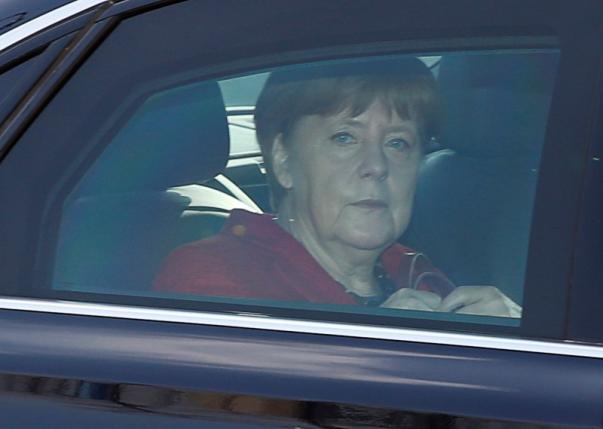 German Chancellor and leader of the Christian Democratic Union Merkel sits in her limousine as she arrives to a party's meeting in Berlin