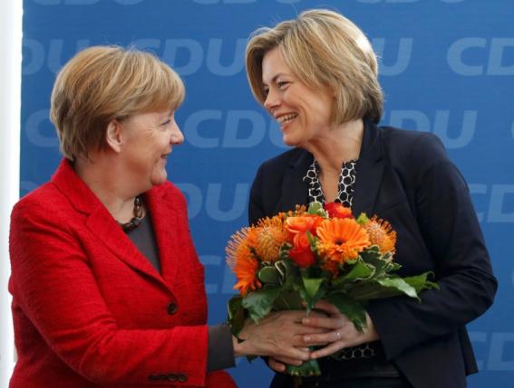 German Chancellor Merkel presents flowers to Kloeckner top candidate in the Rheinland-Palatinate state election in Berlin