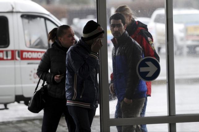 Relative of victims of crashed Flydubai Boeing 737-800 are seen at airport of Rostov-On-Don