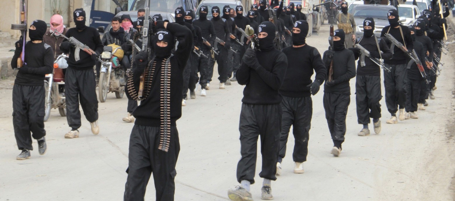 Fighters of  al-Qaeda linked Islamic State of Iraq and the Levant parade at Syrian town of Tel Abyad