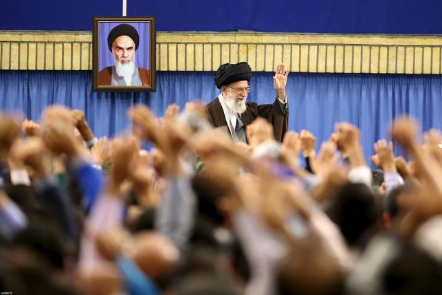 Iran's Supreme Leader Ayatollah Ali Khamenei waves as he arrives to address workers in Tehran