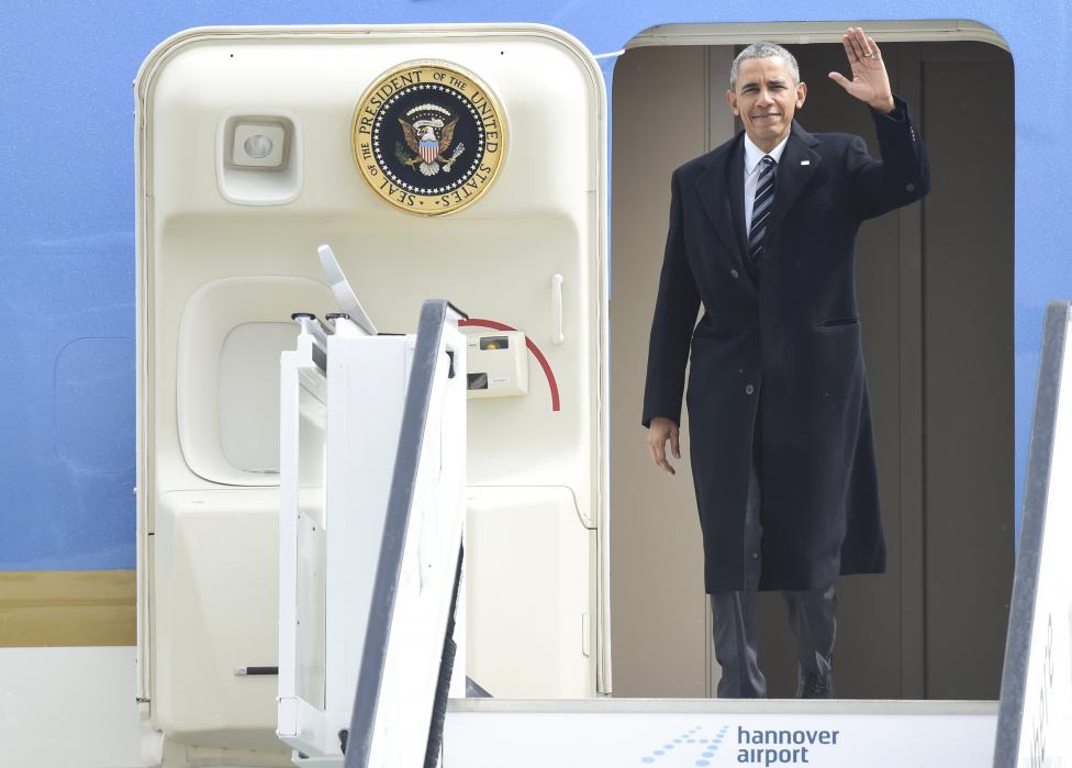 U.S. President Obama waves as he leaves Air Force One after landing in Hanover airport