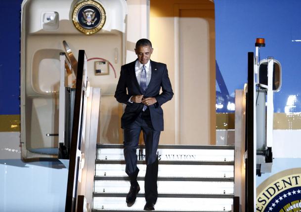 U.S. President Obama walks down the steps of Air Force One as he arrives at Stansted Airport near London, Britain
