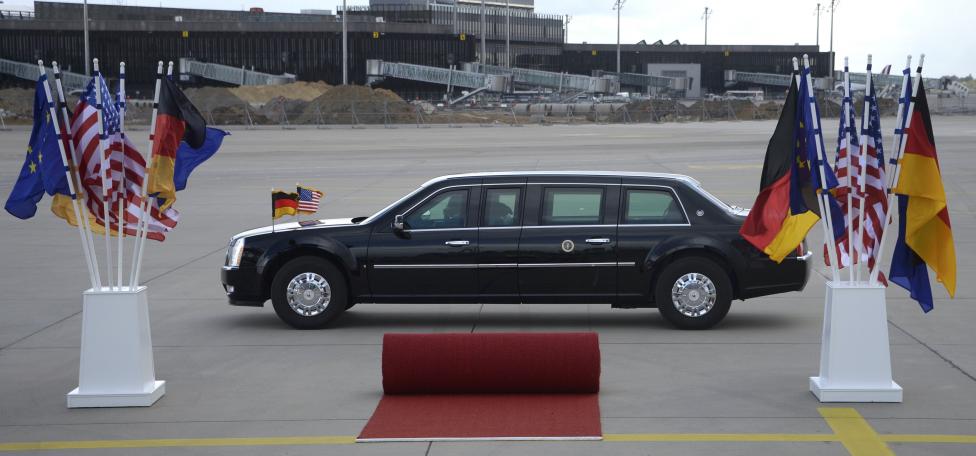 An armoured limousine with U.S. and German flags is parked on the tarmac ahead of U.S. President Barack Obama visit to Hanover