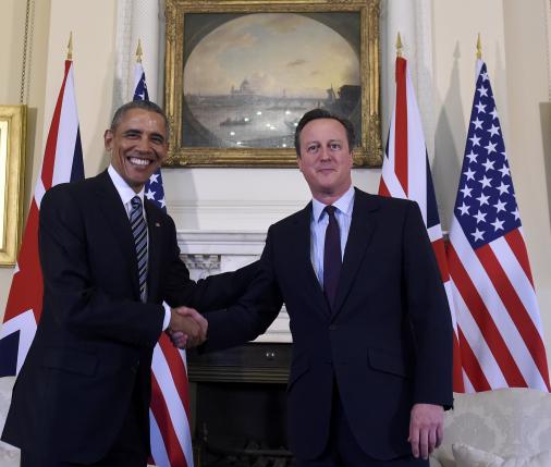 U.S. President Barack Obama is greeted by Britain's Prime Minister David Cameron in 10 Downing Street in London