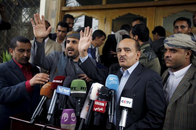 Yahya Doad, a member of the General Committee of the General People's Congress Party, and Mohammed Abdul-Salam, head of the Houthi delegation to scheduled peace talks in Kuwait, gesture after they finish a news conference at Sanaa Airport