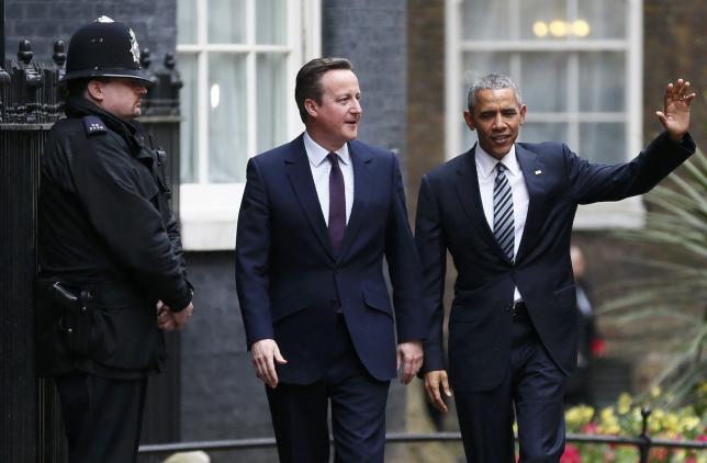 U.S. President Barack Obama is greeted by Britain's Prime Minister David Cameron at Number 10 Downing Street in London