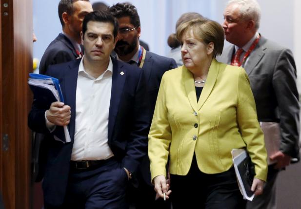 Greece's PM Tsipras and Germany's Chancellor Merkel attend a EU leaders summit in Brussels