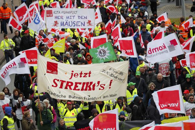 Members of Verdi union march during a strike near Frankfurt airport