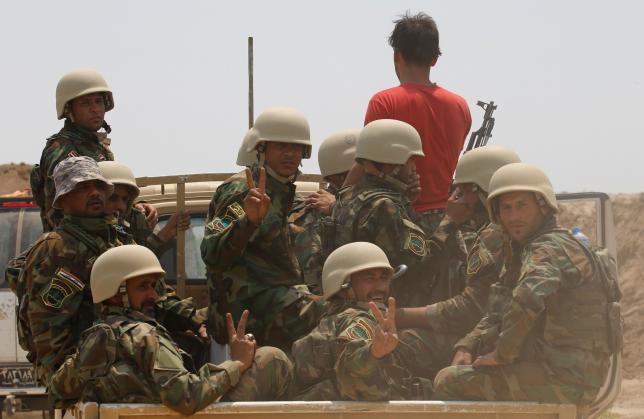 Fighters from Iraqi Shiite group Kataib Sayyid al-Shuhada gather near Falluja