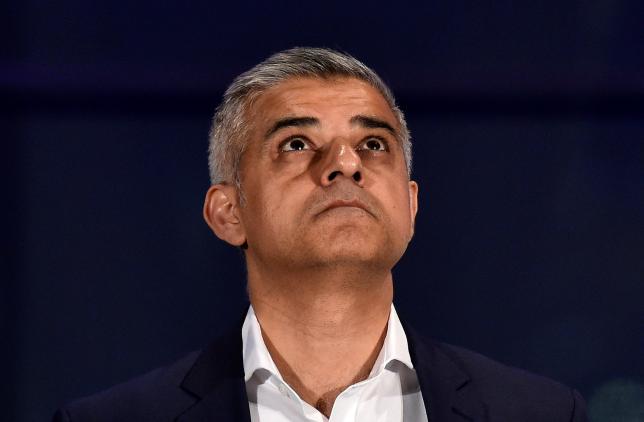 Labour Party candidate for Mayor of London Khan reacts following his victory in London