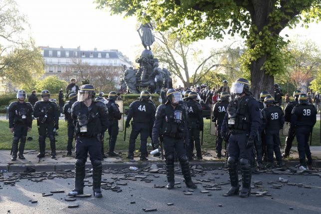 French CRS riot police secure a position at the Place de la Nation after clashes with youths who protest against the French labour law proposal during the May Day labour union march in Paris