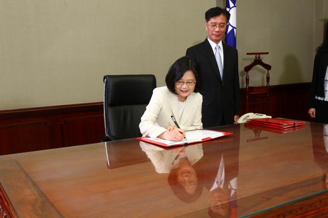Taiwan's President Tsai Ing-wen signs after swearing in at the Presidential Office in Taipei