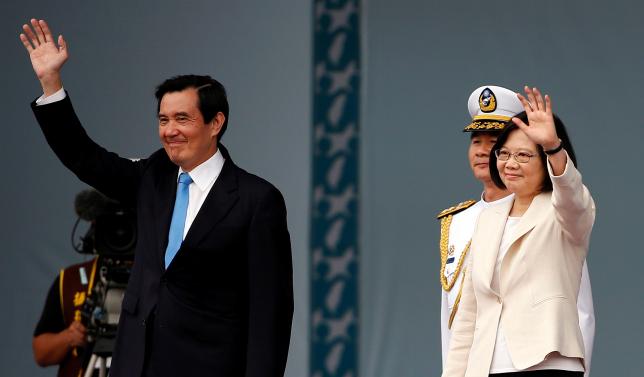 Taiwan’s new president Tsai Ing-wen and former president Ma Ying-jeou wave during an inauguration ceremony in Taipei