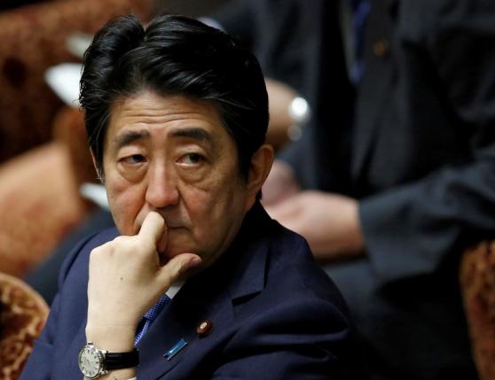 Japan's PM Abe attends a lower house budget committee session at the parliament in Tokyo
