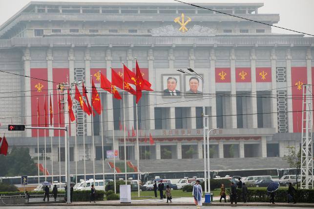 People walk near the venue of a ruling party congress in Pyongyang, North Korea