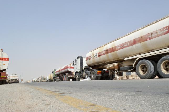 Fuel tanker trucks carrying smuggled petrol are seen on a road linking Bir Ali with Ataq city, the provincial capital of Shabwa province