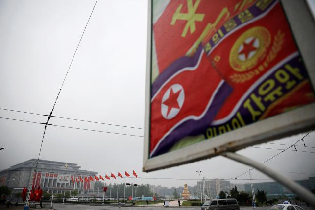 People commute near April 25 House of Culture, the venue of Workers' Party of Korea (WPK) congress in Pyongyang