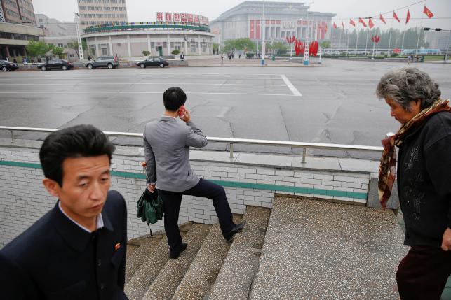 People walk near the venue of a ruling party congress in Pyongyang, North Korea