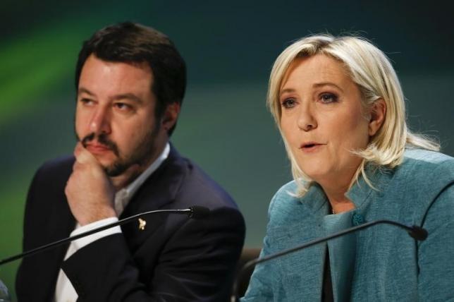 France's far-right National Front political party leader Le Pen talks next to Northern League leader Salvini, during a news conference at the end of the "Europe of Nations an freedom" meeting in Milan