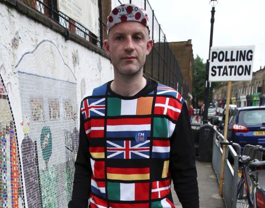 A man wearing a European themed cycling jersey arrives to vote at a polling station for the Referendum on the European Union in north London